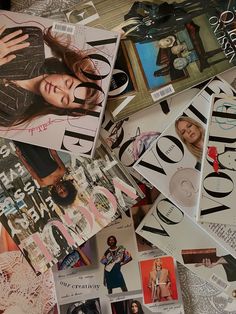 a pile of magazine covers sitting on top of a table