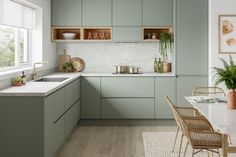 an image of a kitchen setting with green cabinets and white counter tops, plants in pots on the shelf