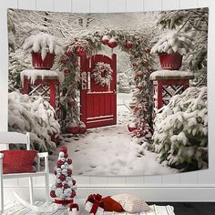 a christmas scene with a red door and snow covered trees in the background is featured on this wall tapestry