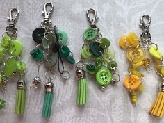 four different key chains with buttons and tassels