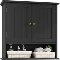 a black cabinet with two white baskets and soaps on the bottom shelf next to it