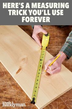 a man measuring wood with a tape measure on it and the words here's a measuring trick you'll use forever