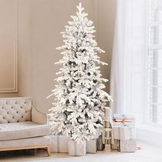 a white christmas tree in a living room