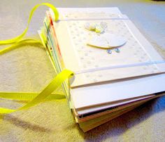 an open book with yellow ribbon on the floor