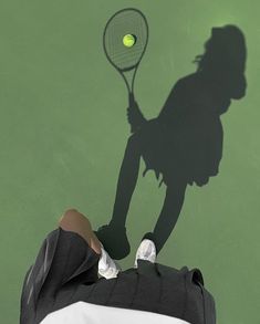 a shadow of a person holding a tennis racket in front of a tennis ball