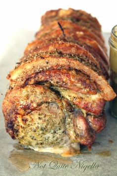 the meatloaf has been sliced and is ready to be eaten with sauce on the side