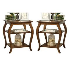 pair of end tables with glass top and wooden legs, one shelf has two pictures on it