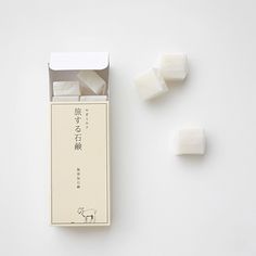 two pieces of marshmallow sitting next to each other on top of a white surface