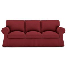 a red couch sitting on top of a white floor