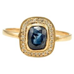 Vintage Deep Bright Blue Sapphire and Diamond Halo Ring Set in 18K Gold featuring natural sapphire of 0.99 carats and diamonds of 0.08 carats. The gorgeous handcrafted ring goes with every style. Sapphire stimulates concentration and reduces stress. Designed with octagon cut sapphire set in a center with halo diamonds studded in solid gold that makes it a perfect fit to wear it on your wedding or style it with any of your basic outfit to give it a glam. This is a perfect Blue Sapphire Ring. It c Heirloom Yellow Gold Sapphire Ring With Halo Setting, Yellow Gold Sapphire Halo Ring Gift, Yellow Sapphire Jewelry With Halo Setting Gift, Luxury Gold Sapphire Ring With Halo, Heirloom Yellow Gold Sapphire Ring, Hallmarked, Vera Wang Engagement Rings, White Engagement Ring, Halo Ring Setting, Contemporary Engagement Rings