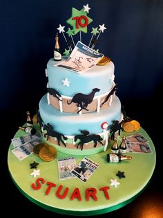 a three tiered cake is decorated with photos and stars on the top, along with other decorations