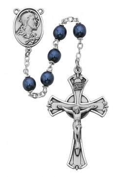 a rosary with an image of jesus on the cross and blue pearls hanging from it