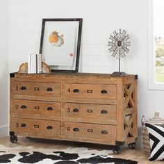 an old dresser with drawers and a mirror on top of it in a white room