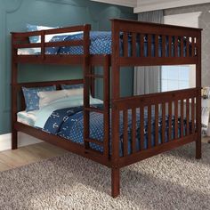 a wooden bunk bed sitting on top of a carpeted floor next to a window