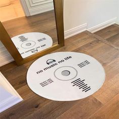 there is a cd on the floor in front of a mirror that says no music or life