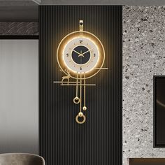 a clock that is hanging on the wall next to a chair and table in a room