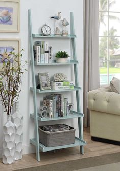 a book shelf with books on it next to a couch