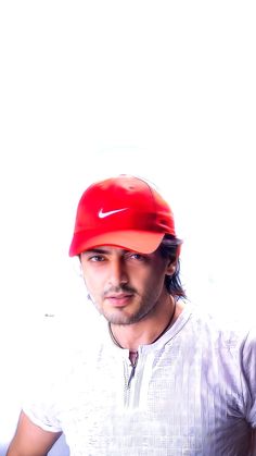 a man wearing a red hat and white shirt