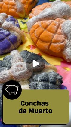 several different types of pastries on display with the words conchas de muerto