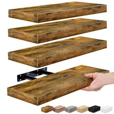 three different types of wood planks being held by two hands and the other hand is holding