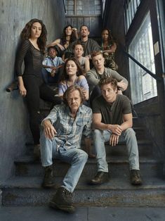 a group of people that are sitting on some stairs