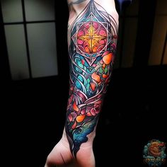 a person with a colorful tattoo on their arm