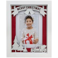 a christmas card with a girl holding a gift box and a truck in the background