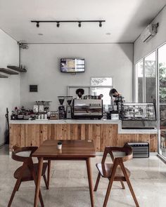 a coffee shop with wooden tables and chairs