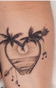 a heart shaped tattoo with musical notes and palm trees