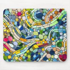 a colorful mosaic design mousepad with lots of different colors and shapes on the surface