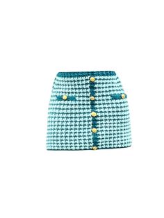 a blue and white skirt with gold buttons