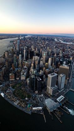 an aerial view of new york city at sunset