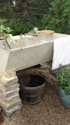 an old bathtub is being used as a planter