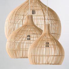 two wicker lamps hanging from the ceiling