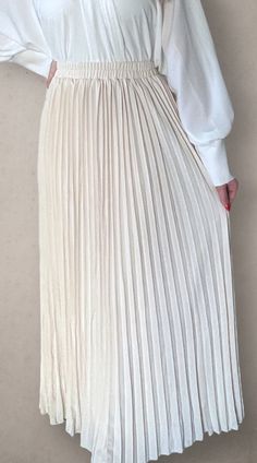 Modest high rise maxi skirt. Elastic waistband. Pleated. Fully lined for full coverage. Elegant Non-stretch Beige Skirt, Beige Maxi Length Lined Skirt Bottoms, Chic Non-stretch Lined Maxi Skirt, White Full-length Skirt For Spring, White Relaxed Full-length Maxi Skirt, Beige Maxi Length Spring Bottoms, Beige Maxi Length Bottoms For Spring, White Full Length Skirt For Spring, Long Stretch Pleated Skirt With Elastic Waistband