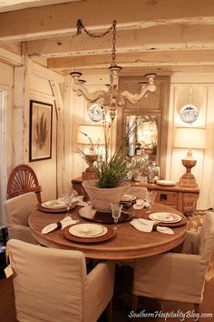 the dining room table is set with place settings for four people to sit and eat