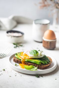 an egg and lettuce sandwich on a plate