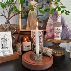 an assortment of items on a table including candles, soaps and other decorative items