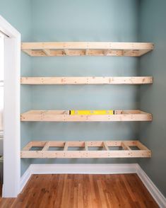 the shelves are made out of wooden planks