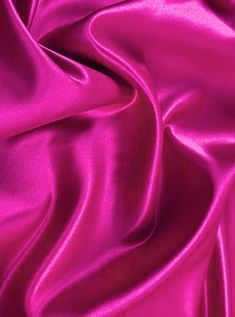 a close up view of a pink satin fabric