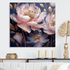 a living room scene with focus on the couch and large flower art hanging above it