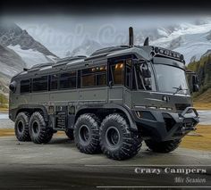 an armored vehicle parked in front of some mountains