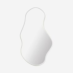 a white mirror with an oval shape on the side and a cord attached to it