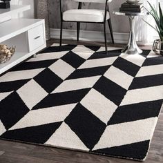 a black and white rug in a living room