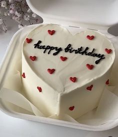 a heart shaped birthday cake in a box