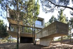 the house is surrounded by trees and grass