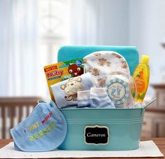 a baby's gift basket is sitting on a table