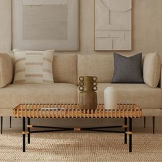 a living room scene with focus on the couch and coffee table in the foreground