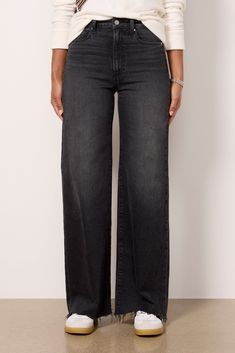 The wide-leg jean you’ll be wearing on repeat. Finished with a full-length inseam, these Paige jeans are crafted in soft stretch denim with a flattering high-rise fit, raw hems, and distressing at the pockets. Take them from day to night with the switch of a shoe. | PAIGE Women's Anessa 31' w Raw Hem Jeans, Size 24, Black Wide Leg Jeans Black, Chic Black Wide-leg Jeans, Black Relaxed Fit Wide-leg Jeans, Black Wide-leg Jeans With Multiple Pockets, Black Wide-leg Cropped Cotton Jeans, Washed Black Wide-leg Denim Jeans, Paige Jeans, Raw Hem Jeans, On Repeat