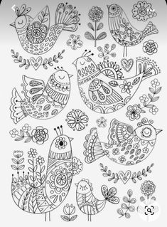 an adult coloring book with birds and flowers